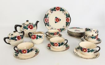 A Japanese earthenware tea service - made for the European market, 1930s, with moulded half-fluted