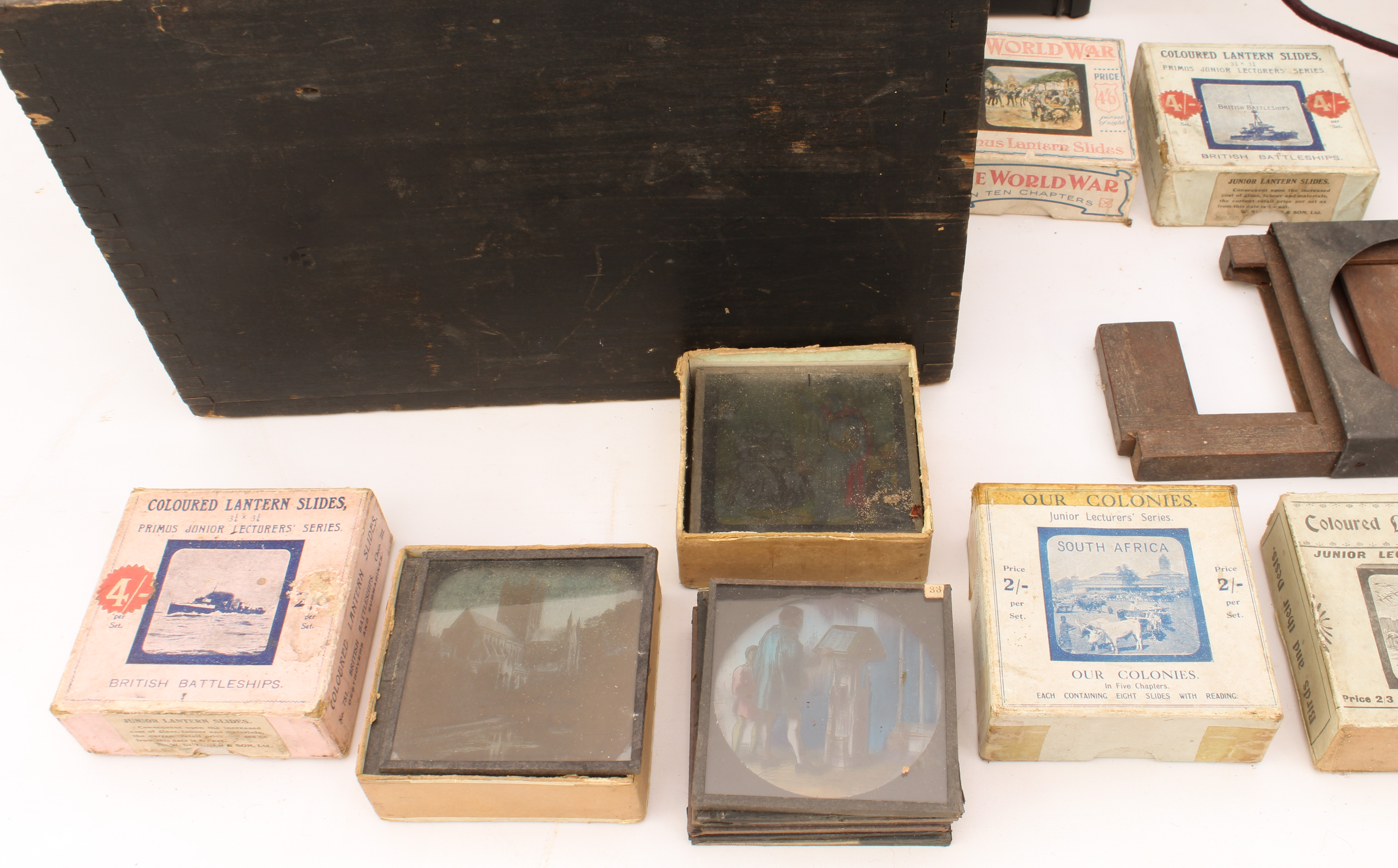 A cased magic lantern and a good quantity of slides to include: a mahogany and gilt-brass hand- - Image 10 of 14