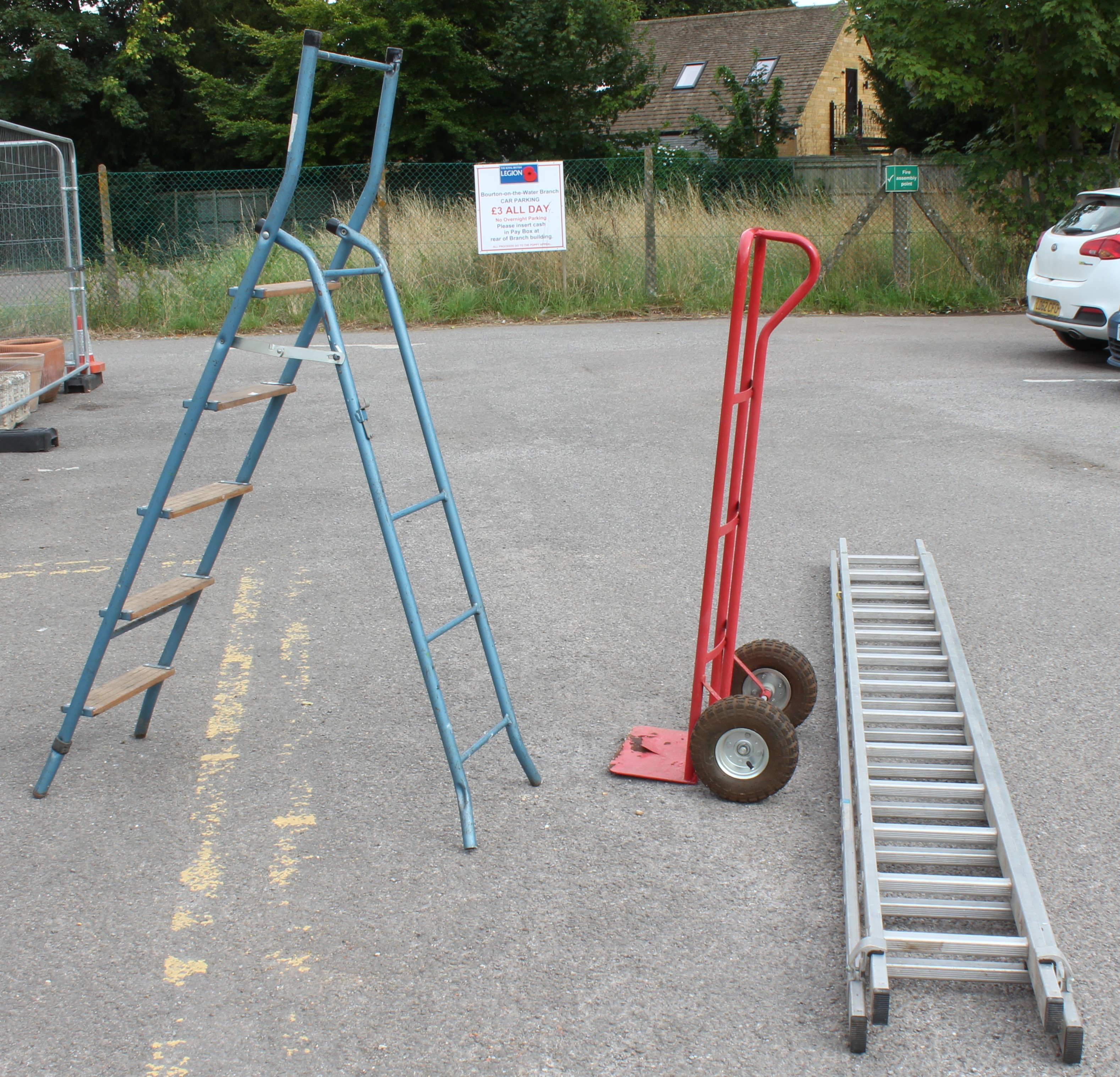 Three pieces: 1. a vintage wooden and painted steel folding stepladder (top rung 118 cm); 2. a