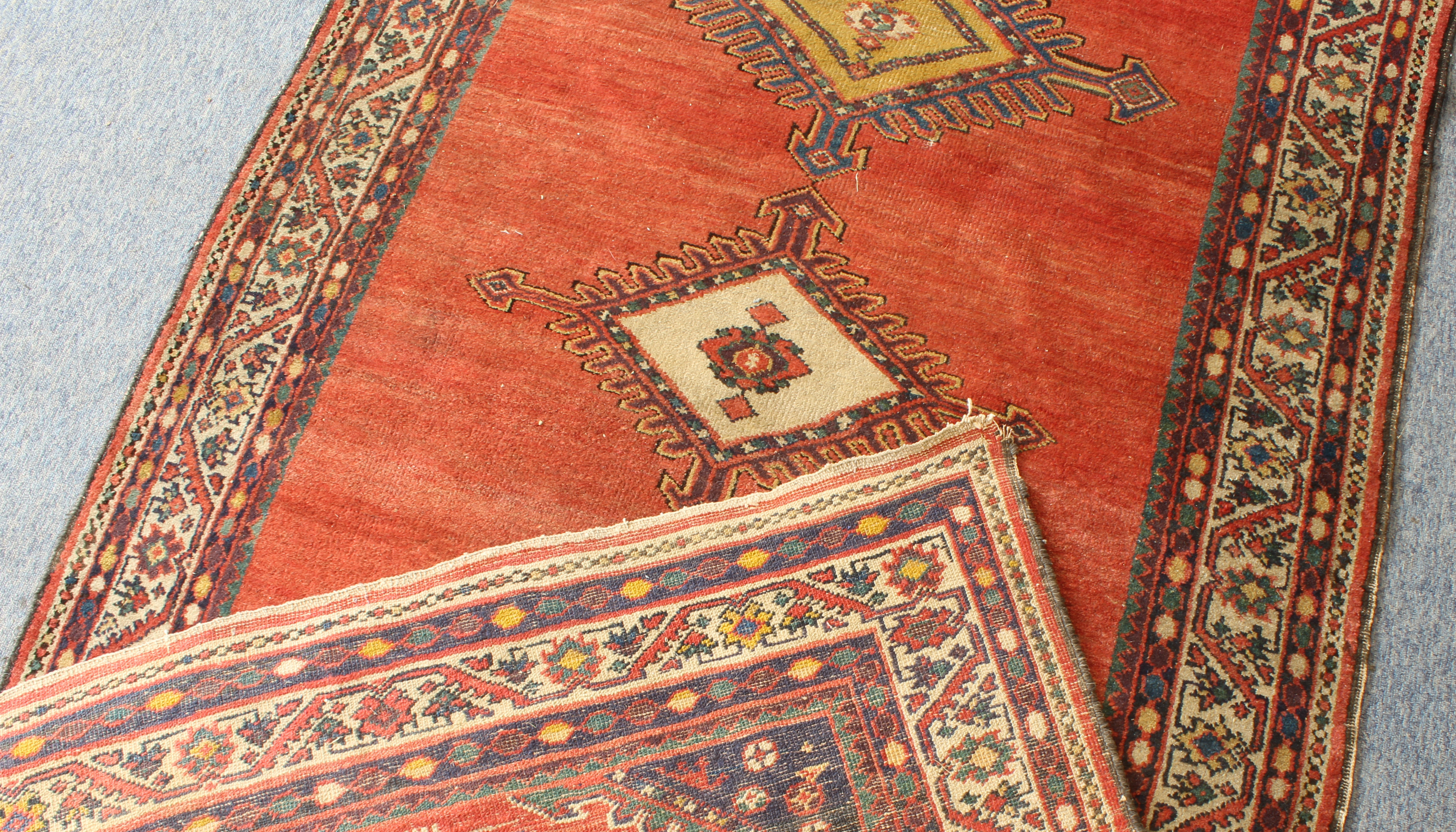 A late 19th century Kurdish corridor carpet - the red ground with five central lozenge medallions in - Image 20 of 20