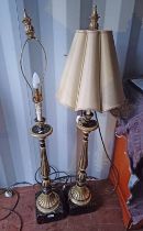 PAIR OF BLACK & GILT TABLE LAMPS WITH REEDED COLUMNS ON SQUARE BASES