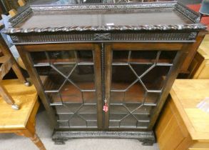 19TH CENTURY MAHOGANY CABINET WITH ASTRAGAL GLASS DOORS WITH CARVED GALLERY ON CARVED BASE WITH