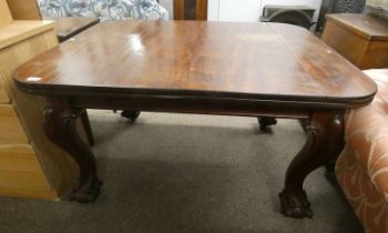 19TH CENTURY MAHOGANY EXTENDING DINING TABLE ON BALL AND CLAW SUPPORTS.