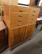 ARTS & CRAFTS STYLE CABINET WITH 8 SHORT DRAWERS OVER 2 DOORS WITH SHELVED INTERIOR .