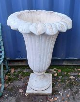 RECONSTITUTED STONE TULIP GARDEN URN ON PLINTH BASE.