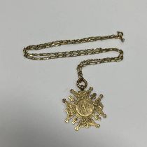 9CT MEDALLION ON A 9CT GOLD CHAIN - 9.