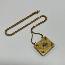 TURQUOISE & RUBY SET YELLOW METAL PENDANT ON AN 18CT GOLD CHAIN - 29.