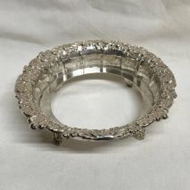 SILVER CIRCULAR DISH HOLDER WITH FOLIATE EMBOSSED DECORATION ON 4 SPLAYED SUPPORTS,