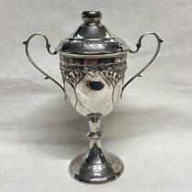 SILVER 2-HANDLED LIDDED TROPHY WITH EMBOSSED DECORATION,