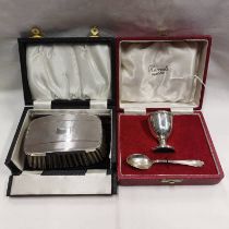 CASED SILVER EGG CUP & SPOON SET RETAILED BY HARRODS & CASED SILVER BRUSH & COMB SET