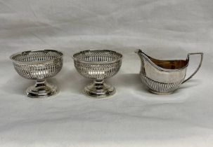 PAIR OF SILVER PEDESTAL DISHES WITH PIERCED DECORATION, CHESTER 1913 & SMALL SILVER CREAM JUG,