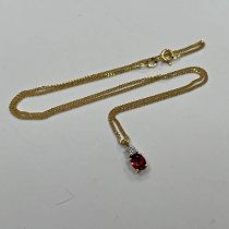 18CT GOLD RUBY & DIAMOND PENDANT ON AN 18CT GOLD CHAIN. THE DIAMOND APPROX 0.10 CARATS - 4.