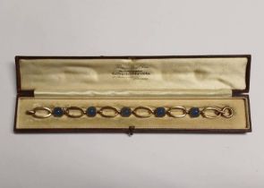 EARLY 20TH CENTURY 9CT GOLD SUGAR LOAF GEM SET BRACELET - 19.5 CM LONG, 13.