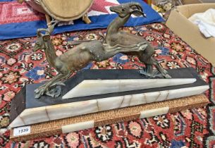 ART DECO PRANCING DEER FIGURE GROUP MOUNTED ON A ONYX AND HARDSTONE BASE,