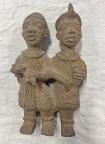AFRICAN TERRACOTTA FIGURE OF TWO FIGURES WITH INTERLOCKING ARMS,