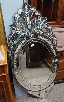 VENETIAN STYLE OVAL MIRROR WITH CUT GLASS DECORATION.