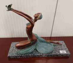ART DECO STYLE FIGURE OF LADY WITH BIRD ON FAUX STONE BASE.