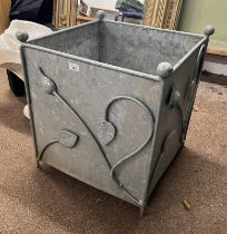 ALUMINIUM PLANTER WITH THISTLE DECORATION .