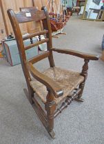 MAHOGANY FRAMED CHILD'S ROCKING CHAIR WITH RUSHWORK SEAT