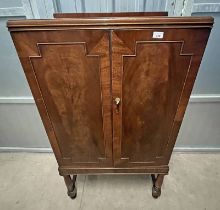 MAHOGANY CABINET WITH 2 PANEL DOORS ON TURNED SUPPORTS
