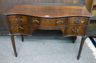 MAHOGANY SIDEBOARD OF 5 DRAWERS WITH SERPENTINE TOP ON SQUARE TAPERED SUPPORTS,