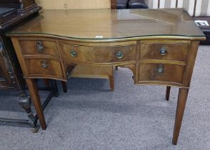 LATE 19TH OR EARLY 20TH CENTURY MAHOGANY SIDE TABLE WITH SERPENTINE FRONT & CENTRALLY SET LONG