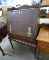 19TH CENTURY OAK BUREAU WITH 3/4 GALLERY TOP OVER FALL FRONT & 2 DRAWERS ON SQUARE TAPERED SUPPORTS.