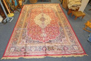 RICH RED GROUND FULL PILE CASHMERE CARPET WITH TRADITIONAL FLORAL MEDALLION DESIGN - 330 X 232 CM