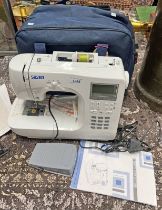 SILVER COMPUTER SEWING MACHINE MODEL 9300E WITH INSTRUCTION MANUAL,