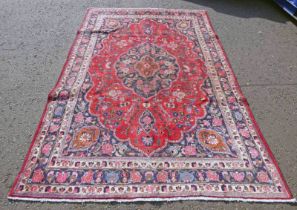 RED GROUND PERSIAN MARSHAD CARPET WITH CENTRAL MEDALLION FLORAL PATTERN - 310 X 205CM