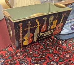 WORCESTER WARE PAINTED METAL NEWSPAPER RACK DECORATED WITH MUSICAL INSTRUMENTS,