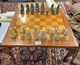 INLAID MAHOGANY CHESS BOARD ON SHAPED SUPPORTS WITH CHESS PIECES