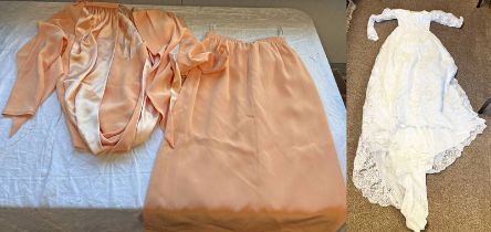 WEDDING DRESS AND AN ORANGE BOWKER 2 PIERCE DRESS IN A SUITCASE,