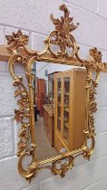 GILT WALL MIRROR WITH FLORAL DESIGN TO FRAME, APPROX.