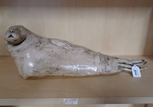 STONEWARE SCULPTURE OF A SEAL,