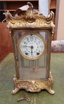 EARLY 20TH CENTURY GILDED METAL MANTLE CLOCK WITH PORCELAIN DIAL WITH FLORAL DECORATION SIGNED