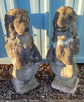 PAIR OF RECONSTITUTED STONE LION FIGURES ON SQUARE PLINTH BASES.