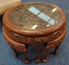 ORIENTAL NEST OF TABLES WITH CIRCULAR TOP WITH CARVED DECORATION & GLASS INSERT 74CM DIAMETER & 4