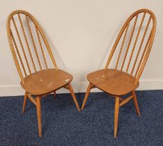 PAIR OF ERCOL STYLE QUAKER CHAIRS ON TAPERED SUPPORTS Condition Report: Both pieces