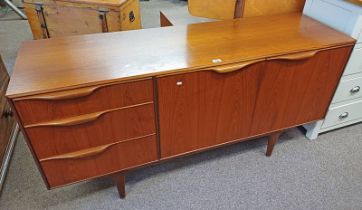 A.H. McINTOSH & CO LTD, TEAK SIDEBOARD WITH 3 DRAWERS & 3 PANEL DOORS ON TAPERED SUPPORTS.