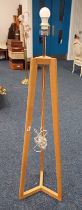OAK FLOOR LAMP WITH TRIPOD BASE Condition Report: The lot has some minor marks and
