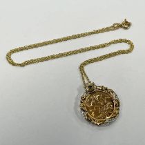 2003 HALF SOVEREIGN PENDANT IN A 9CT GOLD SAPPHIRE & DIAMOND MOUNT ON A 9CT GOLD CHAIN - 7.