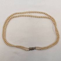DOUBLE STRAND GRADUATED CULTURED PEARL NECKLACE ON A 9CT GOLD DIAMOND SET CLASP Condition