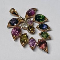 ROSE GOLD LEAF SHAPED PENDANT SET WITH VARIOUS GEM STONES INCLUDING TOURMALINE, STAR RUBY, SAPPHIRE,