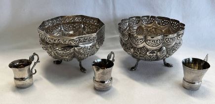 PAIR OF INDIAN WHITE METAL CIRCULAR DISHES EMBOSSED WITH ANIMALS & SET OF 3 ITALIAN SILVER TOT CUPS