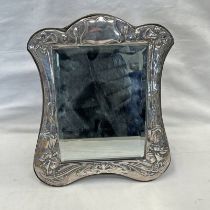 ART NOUVEAU STYLE SILVER FRAMED MIRROR, EMBOSSED WITH STYLISED DAFFODILS,
