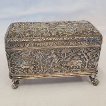 INDIAN WHITE METAL OBLONG BOX DECORATED WITH TIGERS, ELEPHANTS, ETC ON 4 FISH FEET - 16.