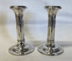 PAIR OF SILVER CANDLESTICKS WITH FLORAL SWAG DECORATION,