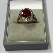 18CT GOLD RUBY & DIAMOND CLUSTER RING,
