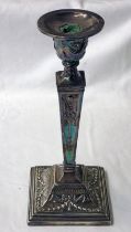 SILVER SQUARE TAPERING CANDLESTICK WITH FLORAL SWAG DECORATION ON A SQUARE BASE,